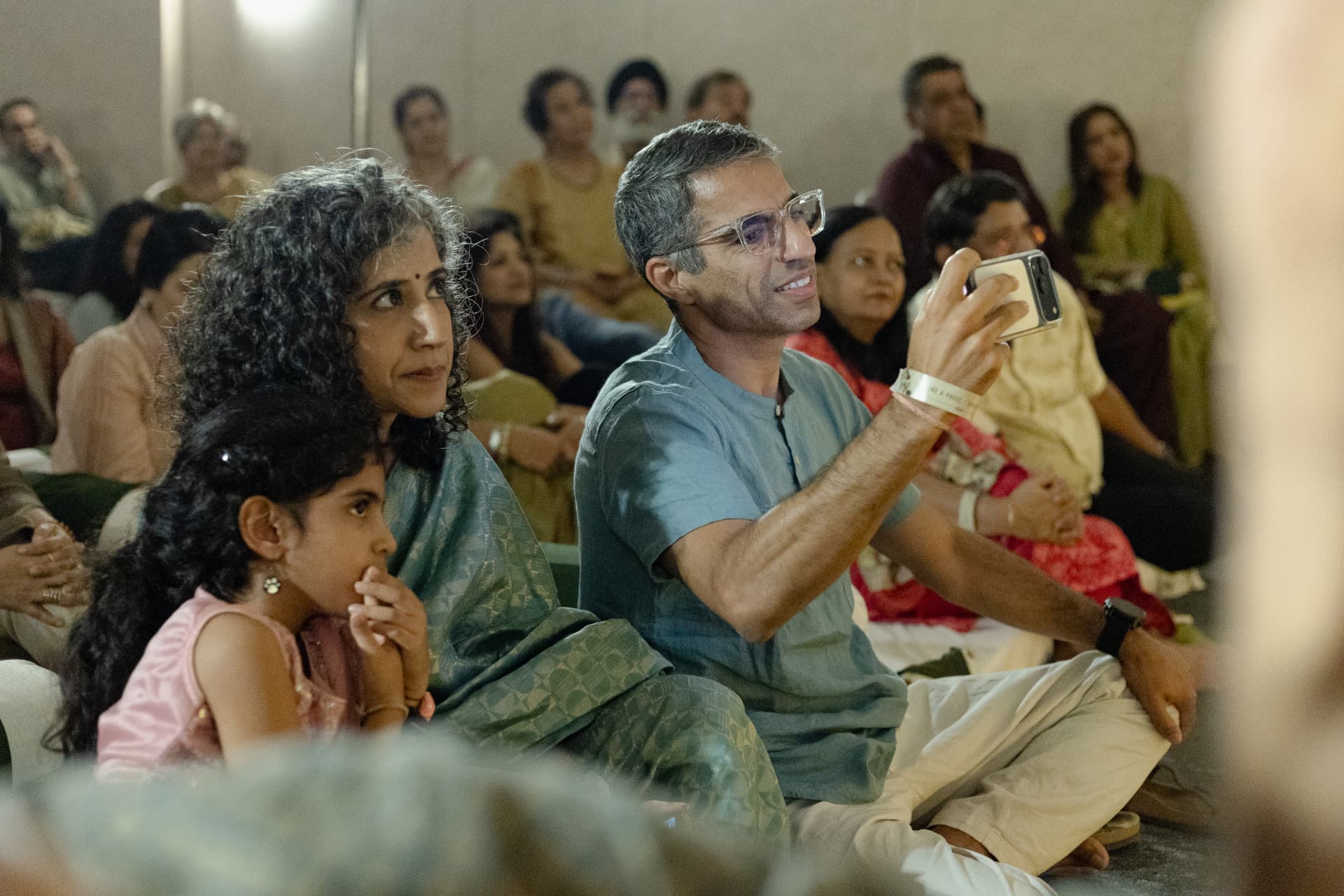 Guests capturing a moment during the performance