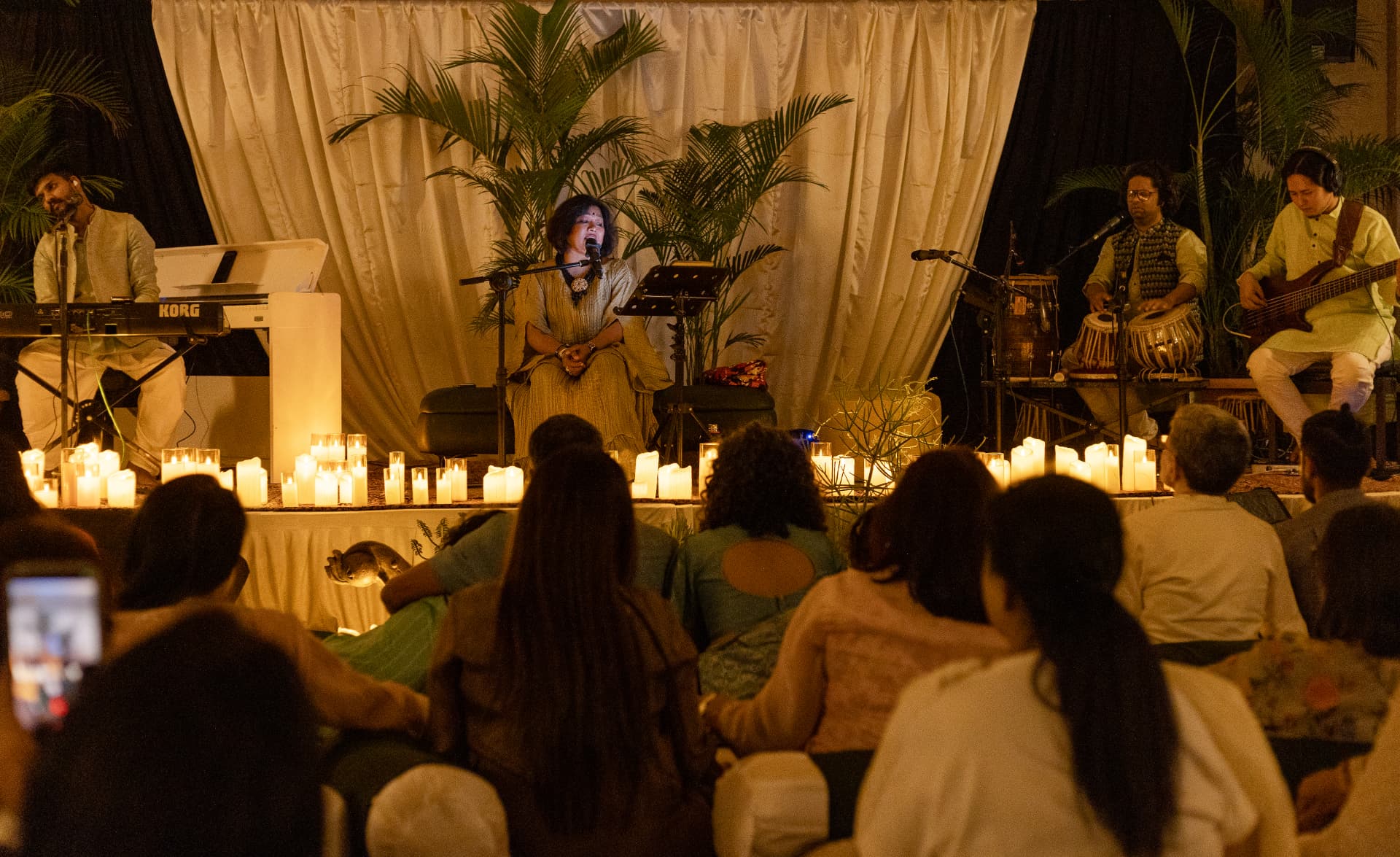The band performing to a full candlelit hall at The Rendezvous — Sukh Dukh ki Baatein