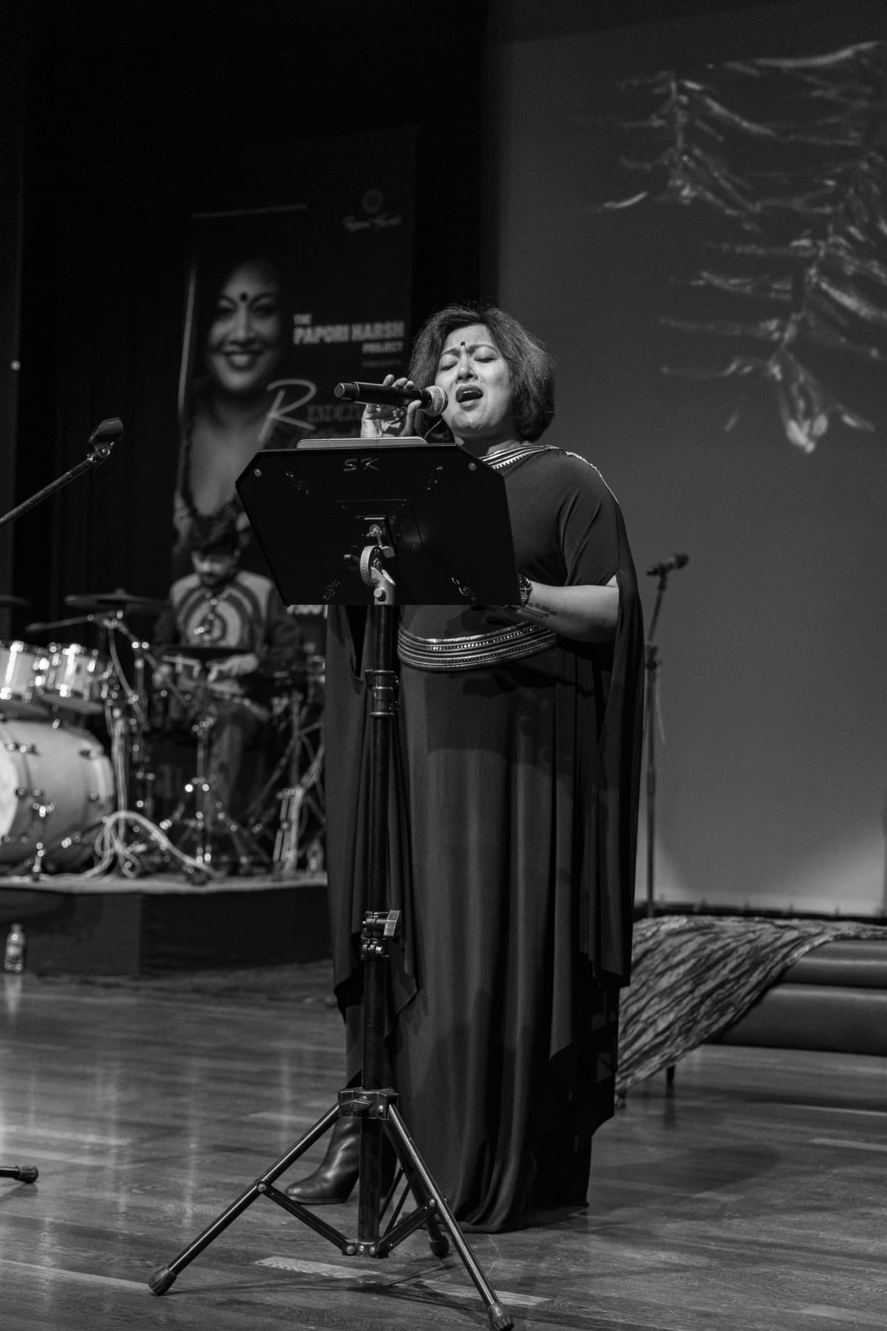 Paapori Harsh singing on stage at The Rendezvous, Bangalore