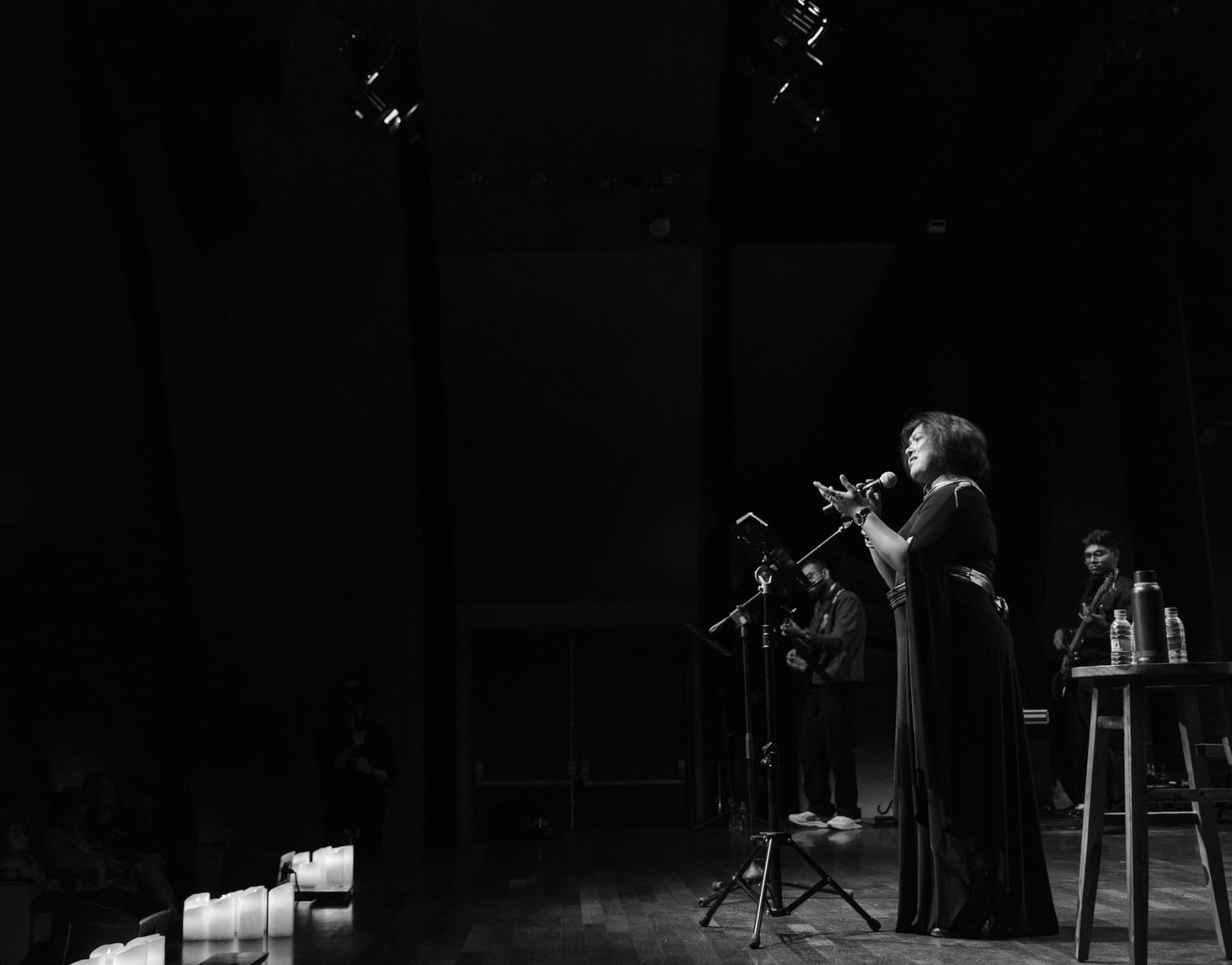 Paapori Harsh addressing the audience by candlelight