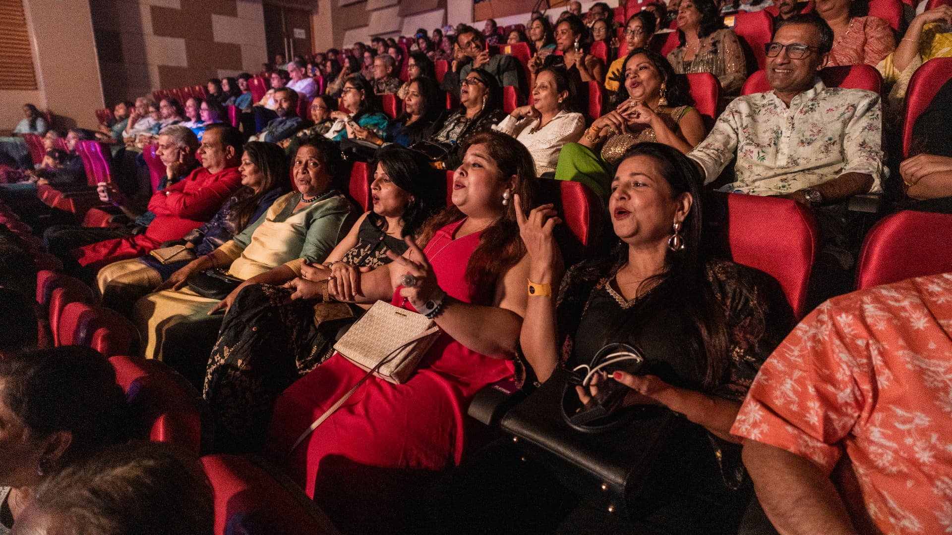 Audience members singing along at The Jugni Concert