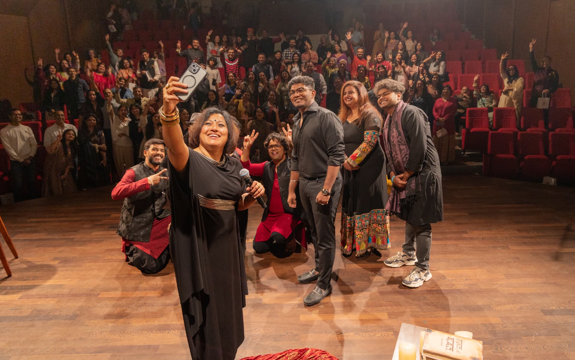 Paapori Harsh taking a selfie with the band and a full house